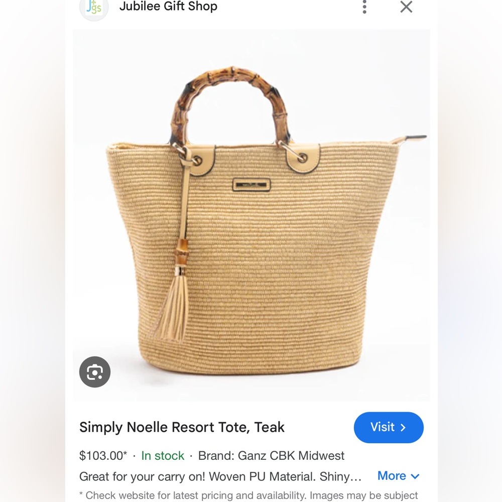 Purse w bamboo handles.. one small spot on back.